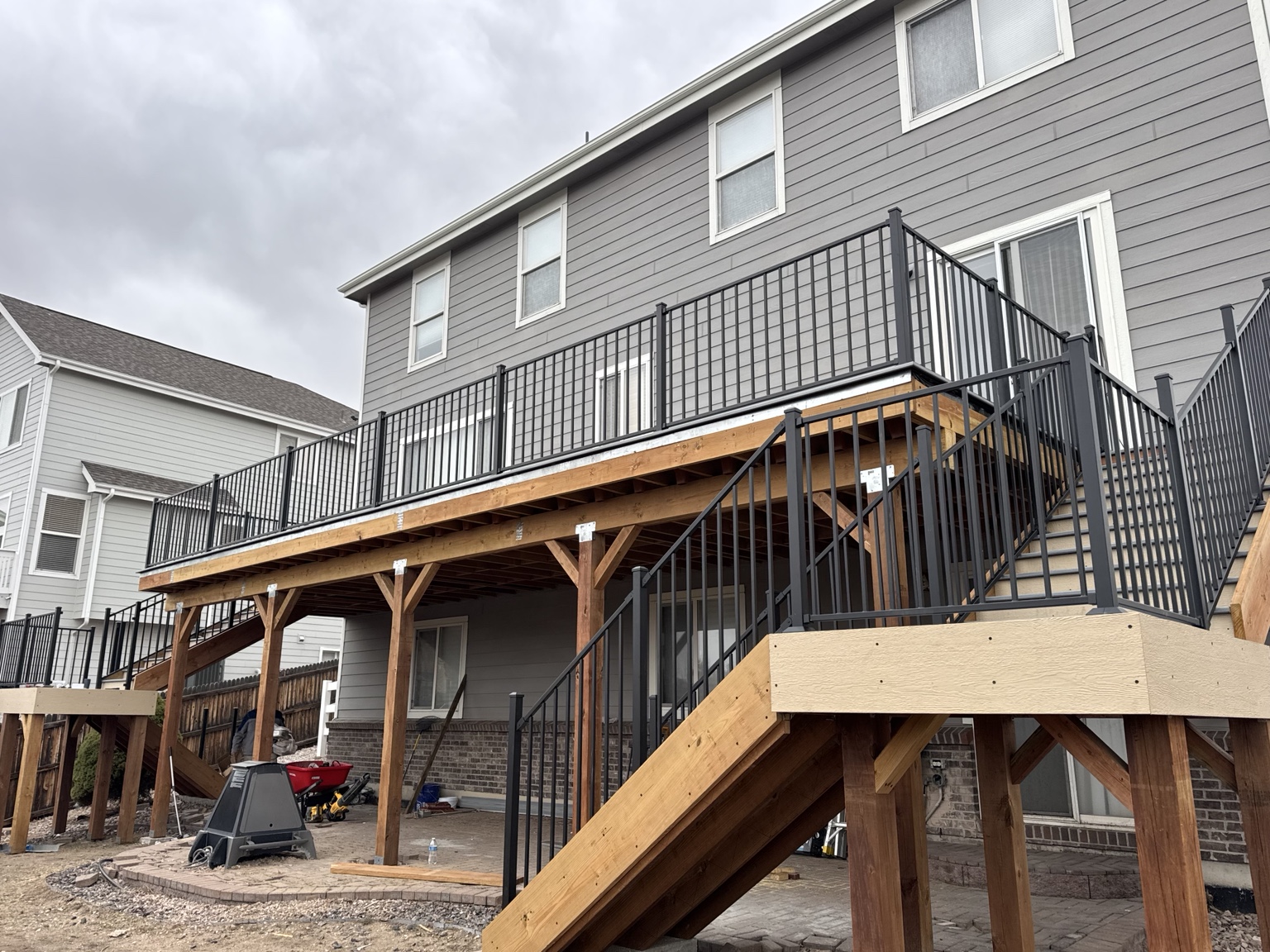 Elevated deck with black metal railings