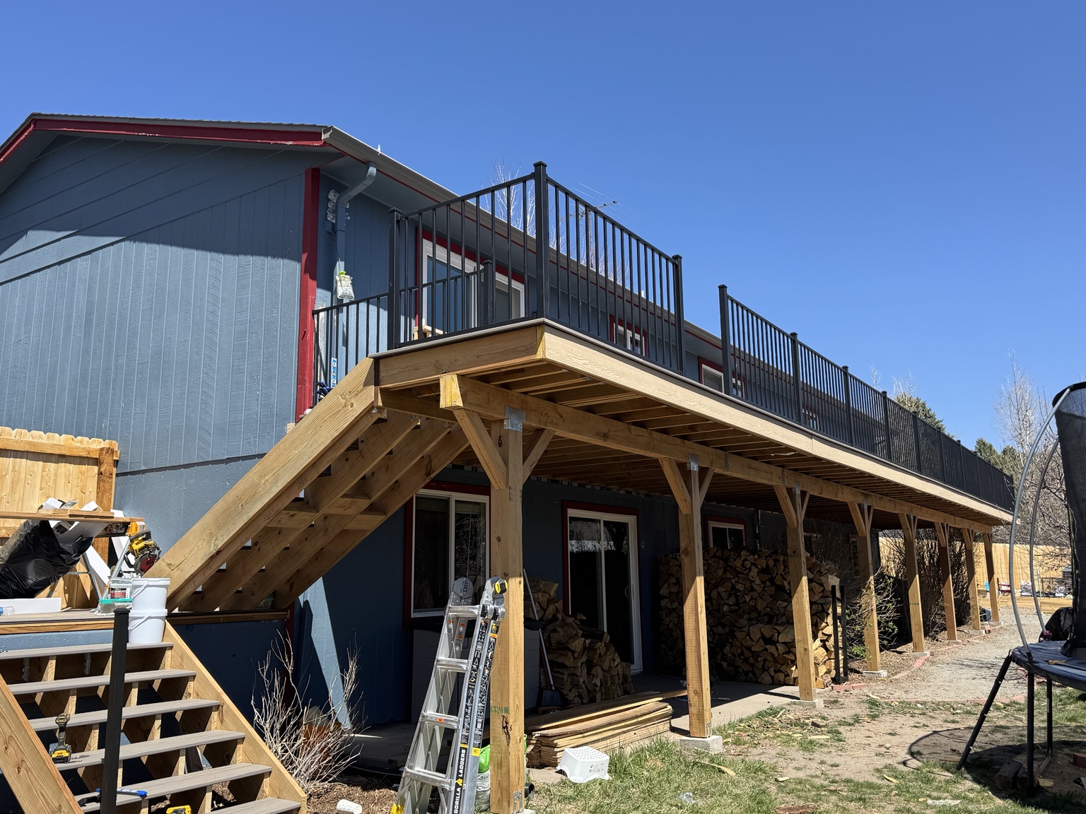 Composite deck boards being installed over framing