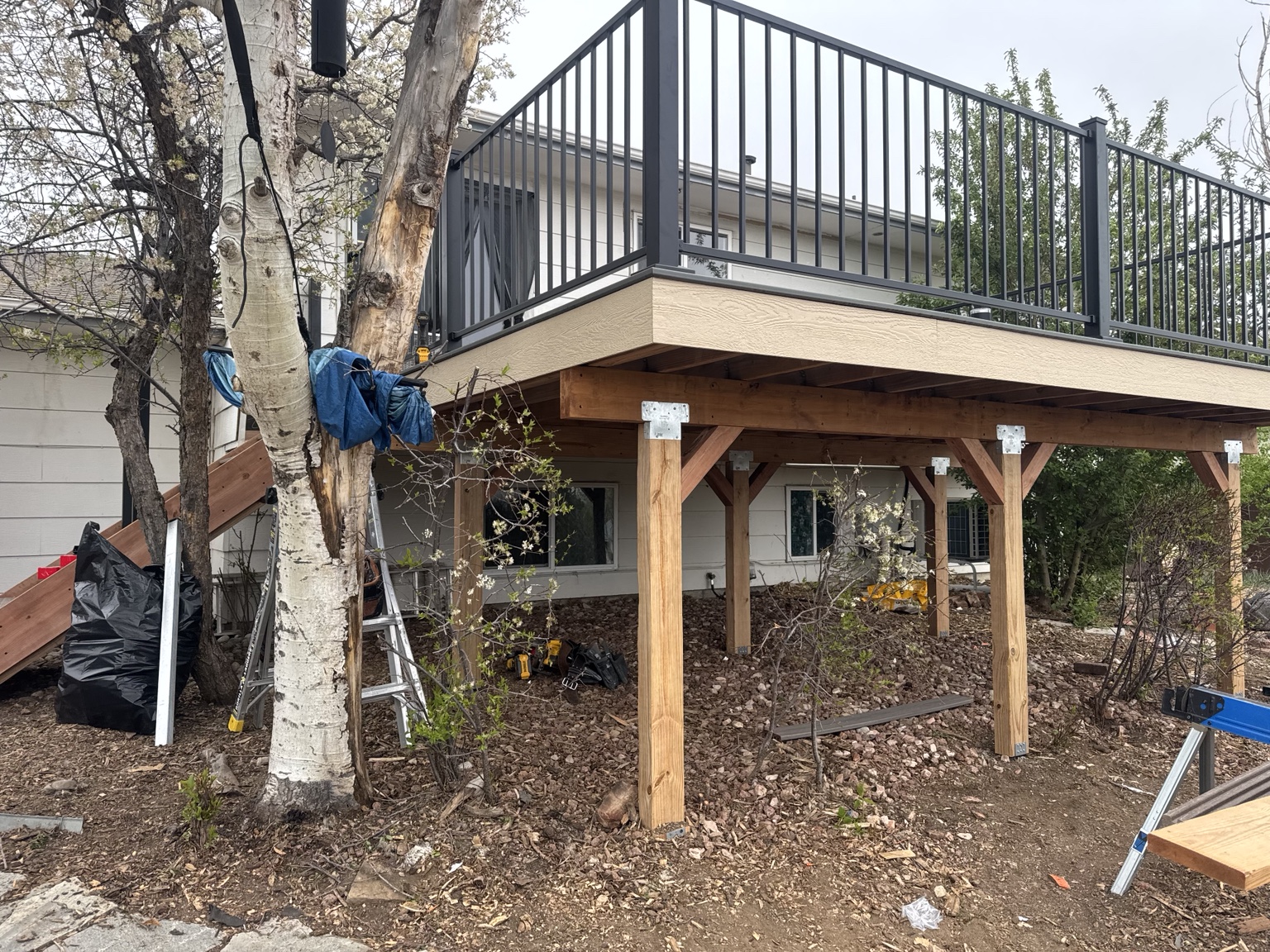 Wood support structure beneath an elevated deck