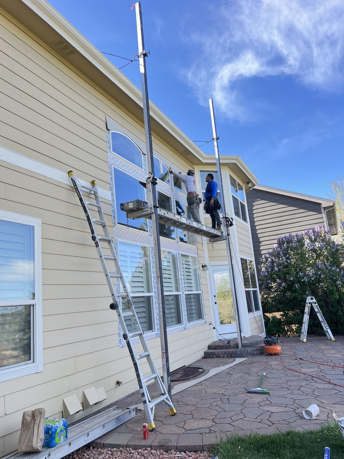 Home exterior siding and window renovation in progress